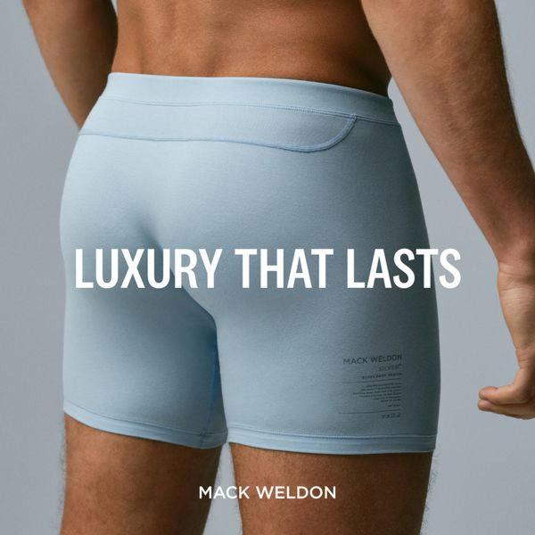 A close-up, high-quality photograph of boxer briefs worn by a model, centered with clean text highlighting product longevity.
